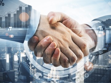 Händeschütteln vor einer Skyline und Grafiken - Bildmontage Händeschütteln vor einer Skyline und Grafiken - Bildmontage